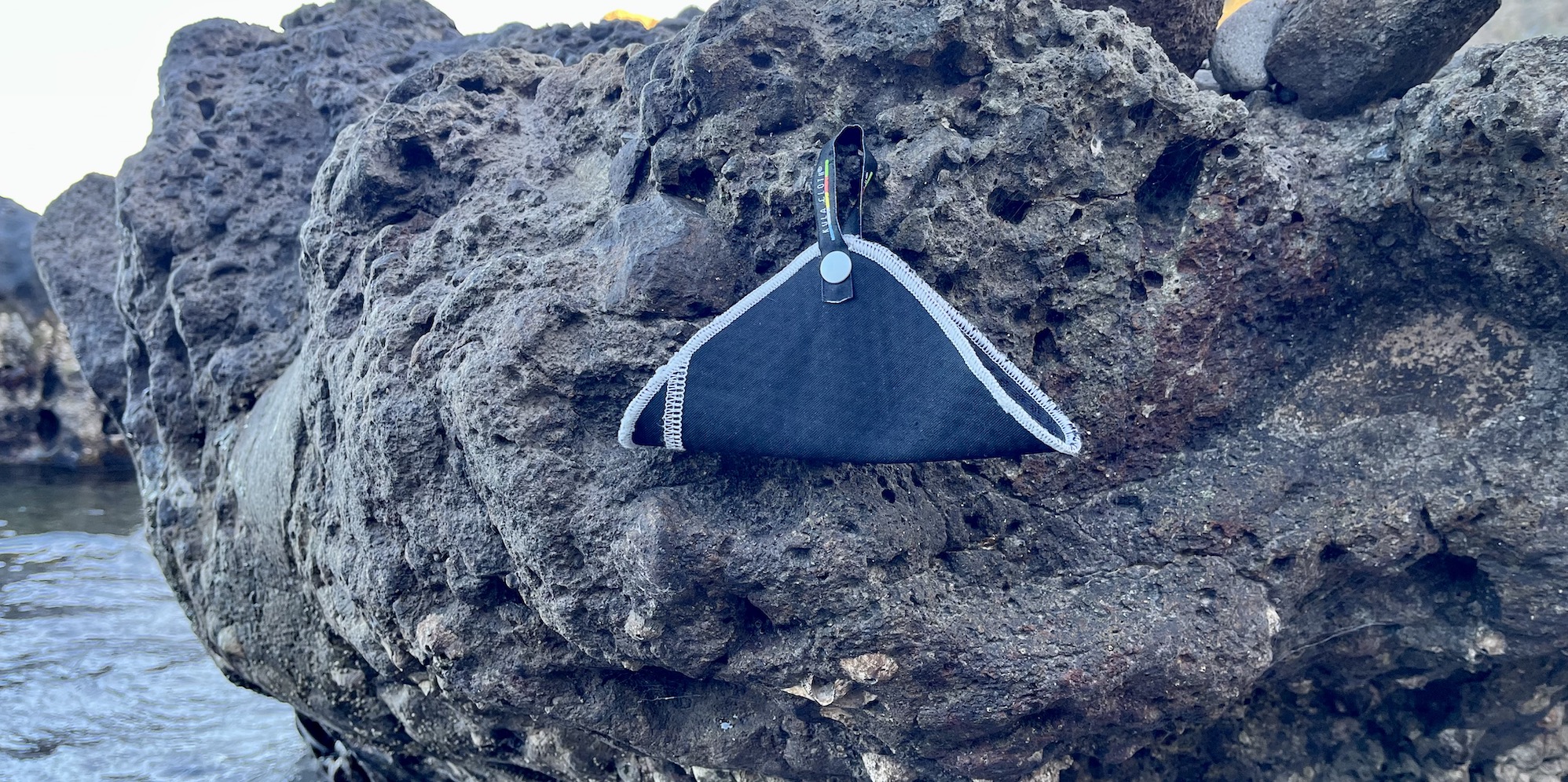 Kula Cloth hanging from a rock 