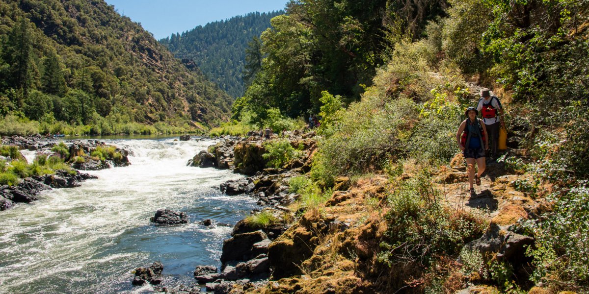 Rogue River in Late May to mid-June while people walk around Rainie Falls on a sunny day