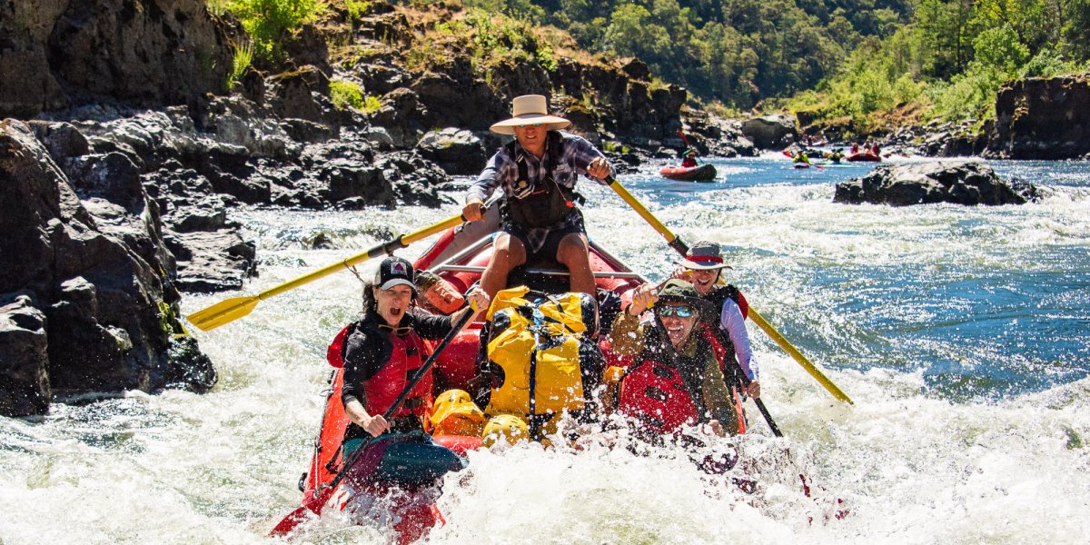 ROW Adventures rafting the Rogue River in Mid-August to mid September going through a rapid