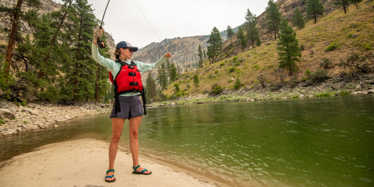A ROW Adventures guest practices her fly cast during some downtime at camp on the Middle Fork of the Salmon River. 