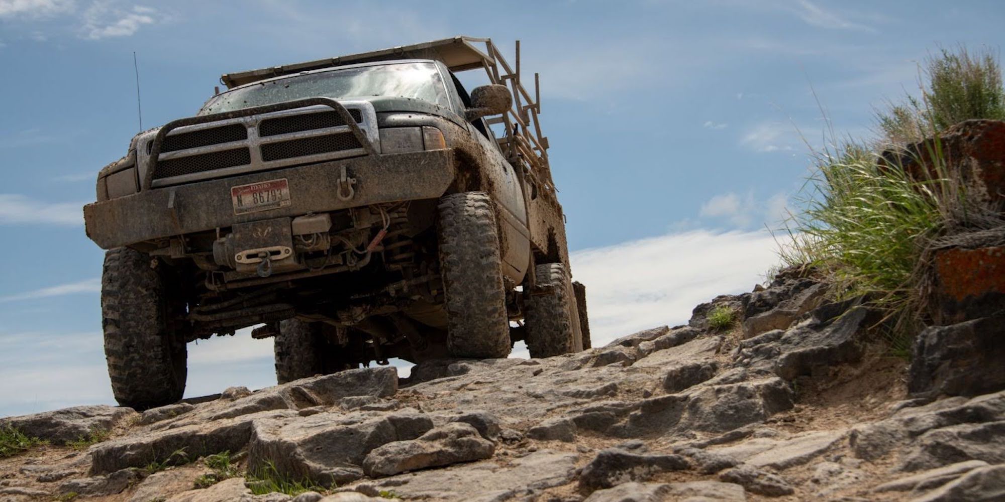 Off-roading truck going over large rocks on the way to the Bruneau River launch site
